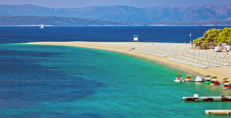 the Zlatni Rat white-sand beach during a yacht charter in Croatia