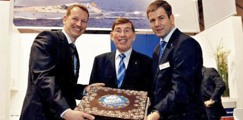 Herbert Dahn (middle) sells Dahm International